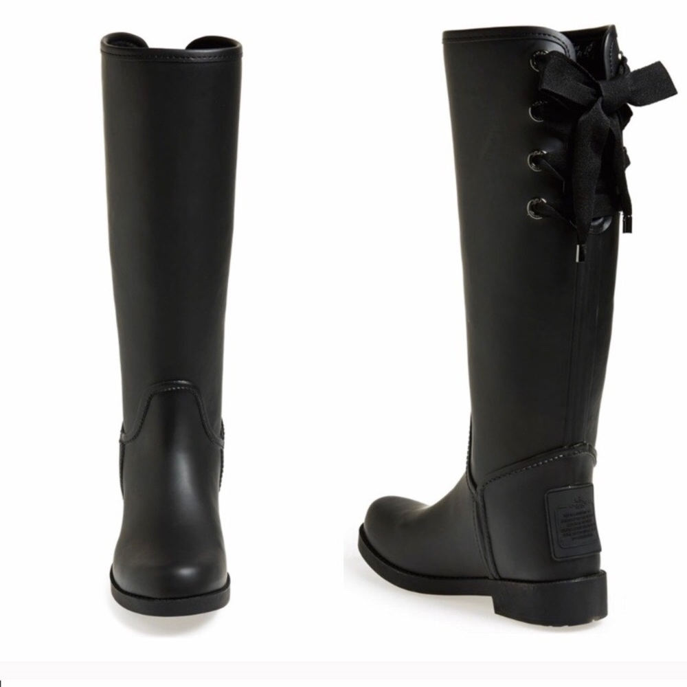 Black coach rain boots with lace up detail